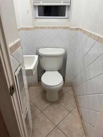 a bathroom with a toilet and a sink