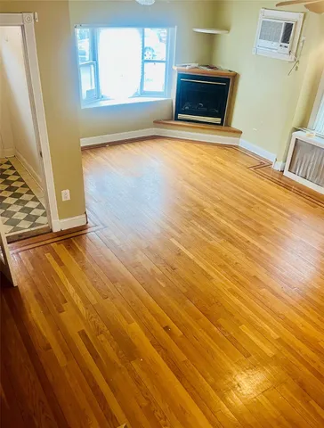 a living room with a wooden floor