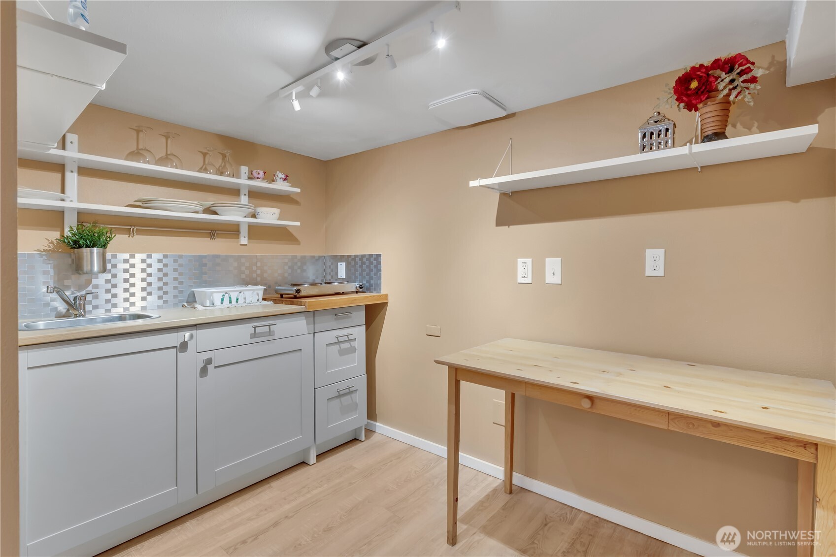 2307 Southwest Myrtle Street Seattle, WA 98106 - Photo 21 of 30 a kitchen with white cabinets and sink