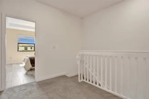 a view of outdoor space with seating area and palm trees