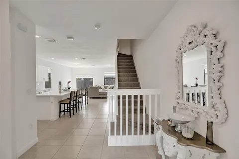 a kitchen with a sink a counter top space and appliances