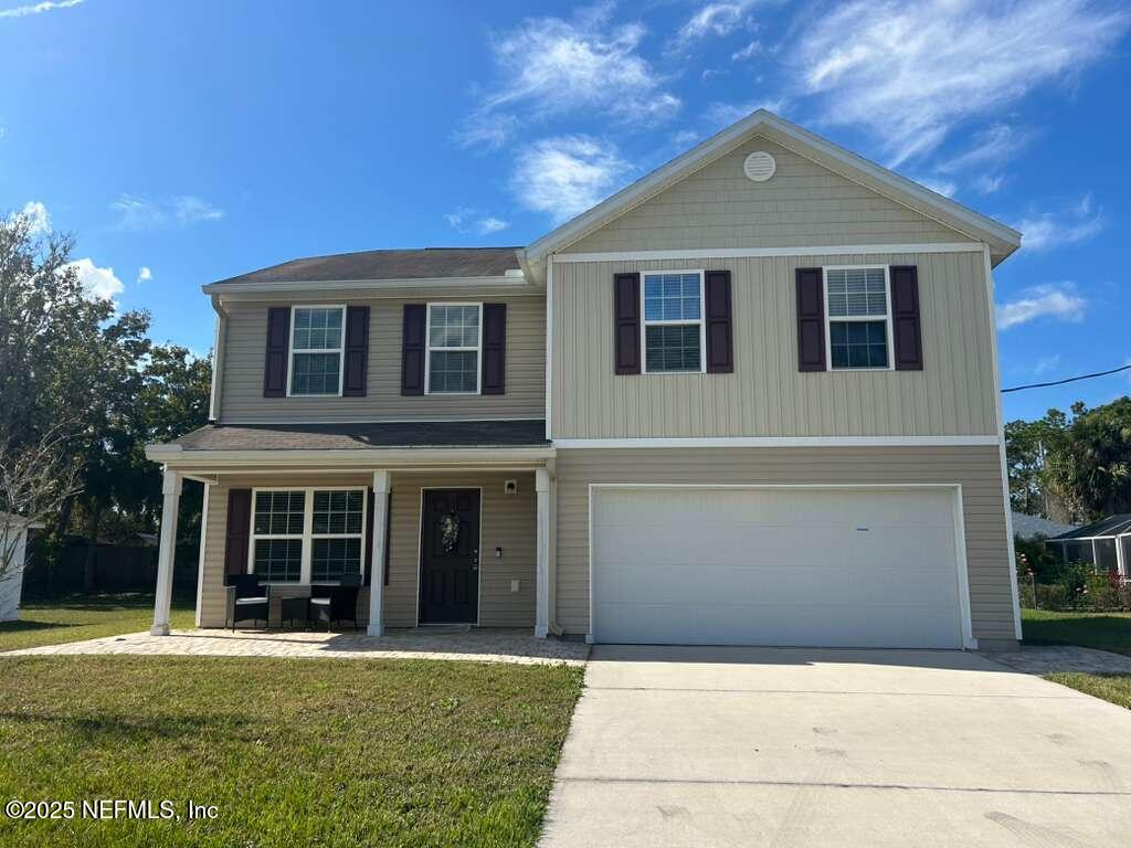 front view of a house with a yard