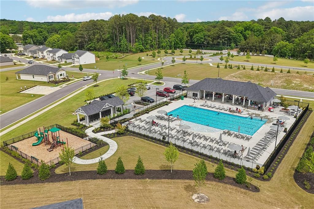 8592 Seabiscuit Road Lithonia, GA 30058 - Photo 24 of 25 a view of swimming pool with a garden