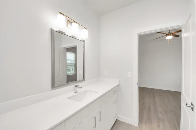 a view of kitchen with center island and wooden floor