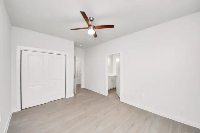 a view of a hallway with windows