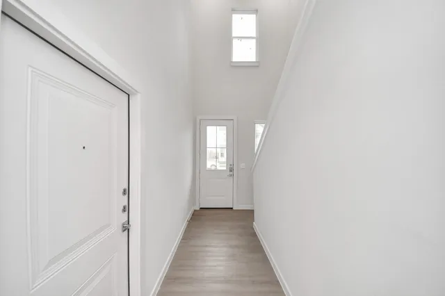 a front view of a house with a garden and yard