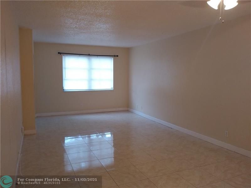 6501 Winfield Boulevard, Unit A11A Margate, FL 33063 - Photo 2 of 10 a view of an empty room and window