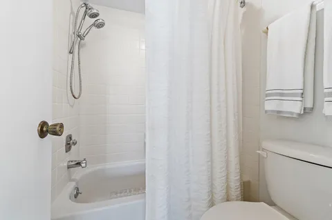 a en suite bathroom with a sink and a mirror