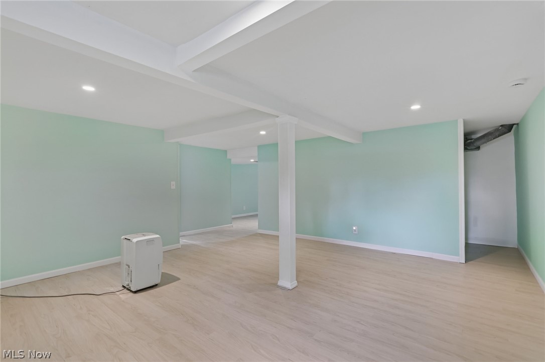 4188 Manchester Road Perry, OH 44081 - Photo 35 of 41 Recessed lighting illuminates the open area featuring light wood-finish flooring and structural columns