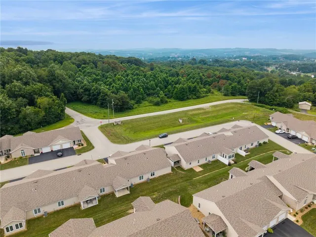 an aerial view of a house with a garden