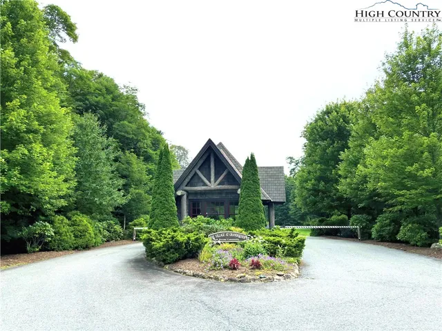 a house with a lot of plants in front