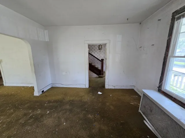 a view of an empty room with windows