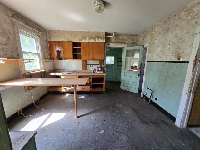 a room with furniture a window and a table