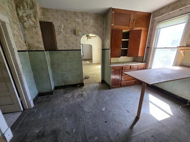a view of livingroom with furniture and window
