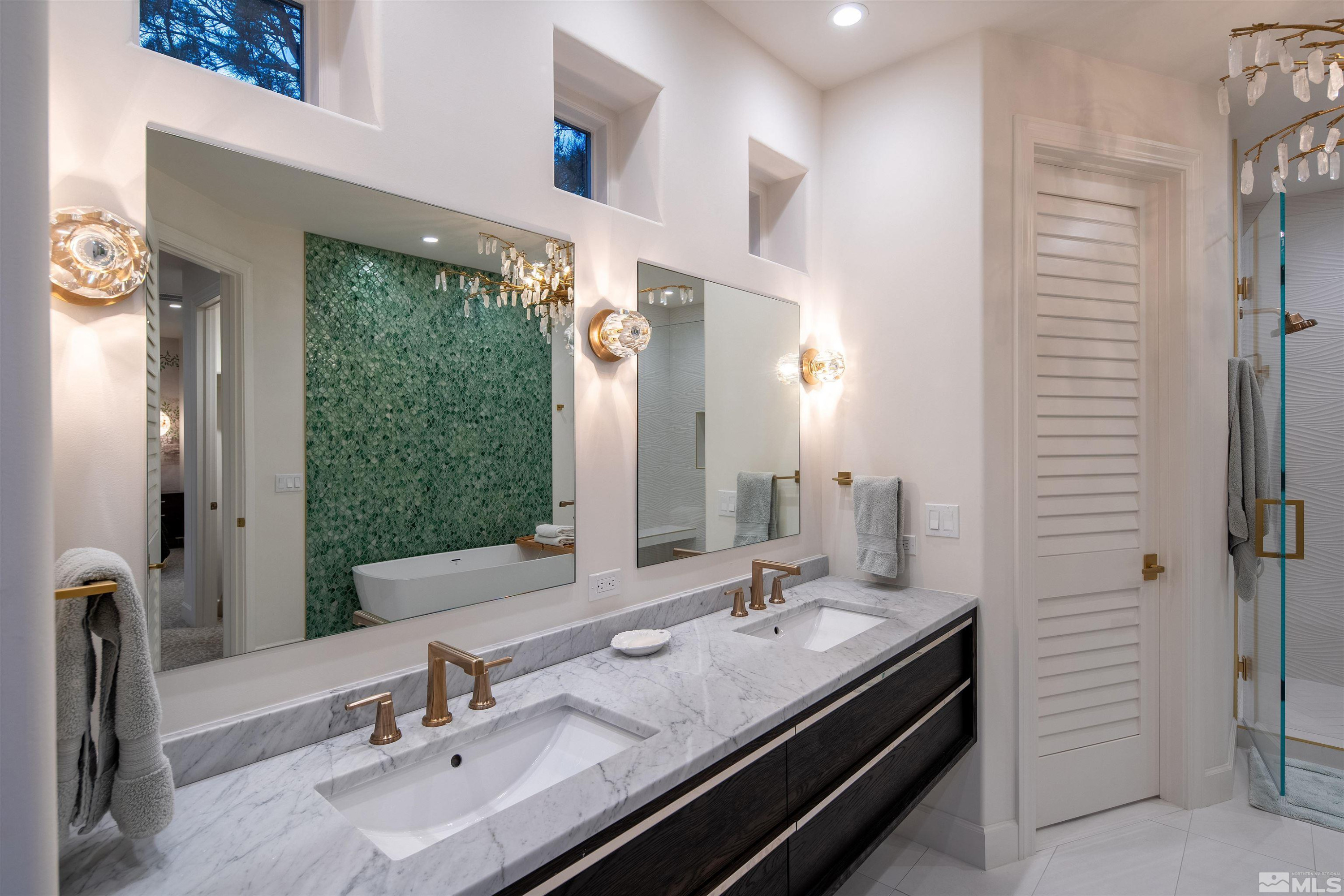 4305 Juniper Trail Reno, NV 89519 - Photo 13 of 30 a bathroom with double vanity sinks and a mirror