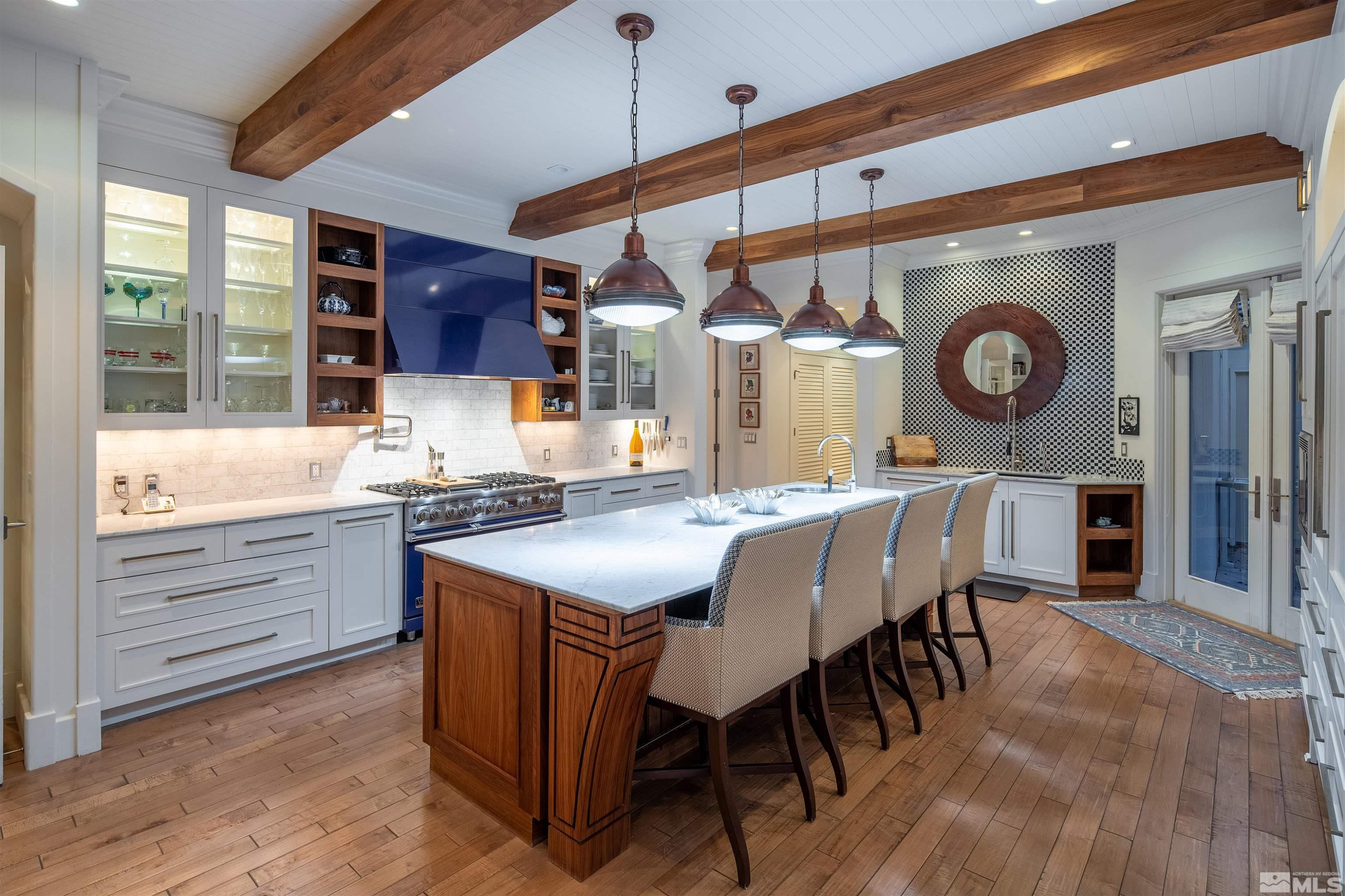 4305 Juniper Trail Reno, NV 89519 - Photo 16 of 30 a kitchen with a table chairs and a wooden floor