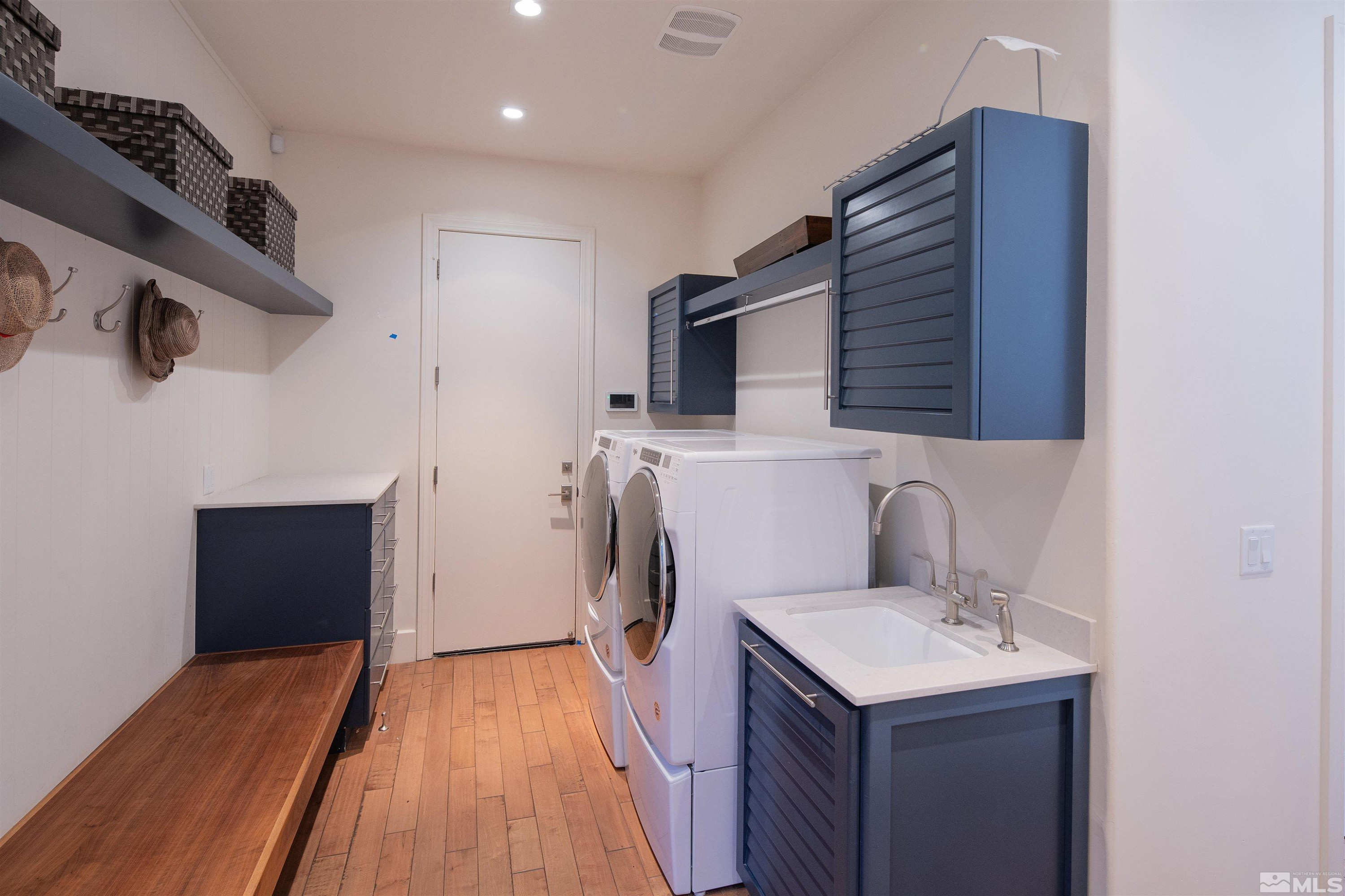 4305 Juniper Trail Reno, NV 89519 - Photo 22 of 30 a kitchen with a sink a refrigerator and wooden floor