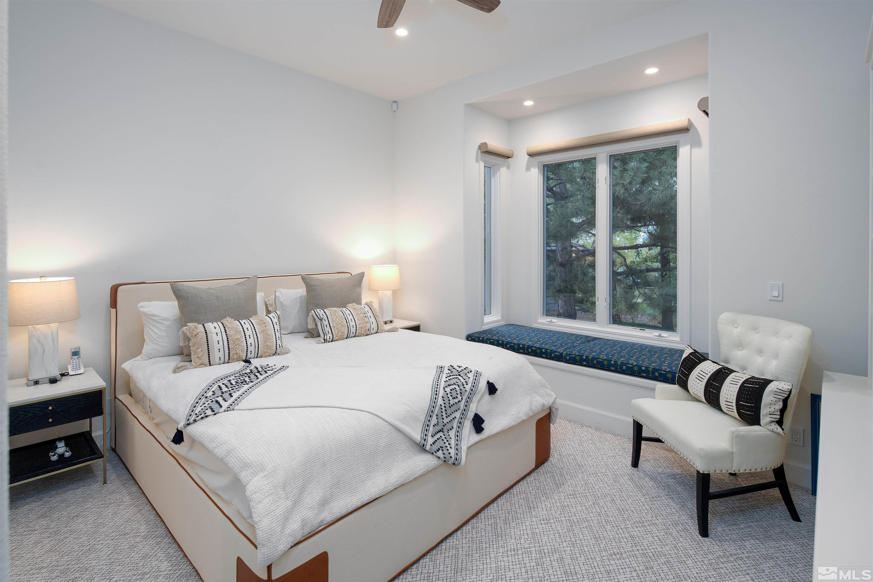 4305 Juniper Trail Reno, NV 89519 - Photo 25 of 30 a large white bed sitting in a bedroom next to a window