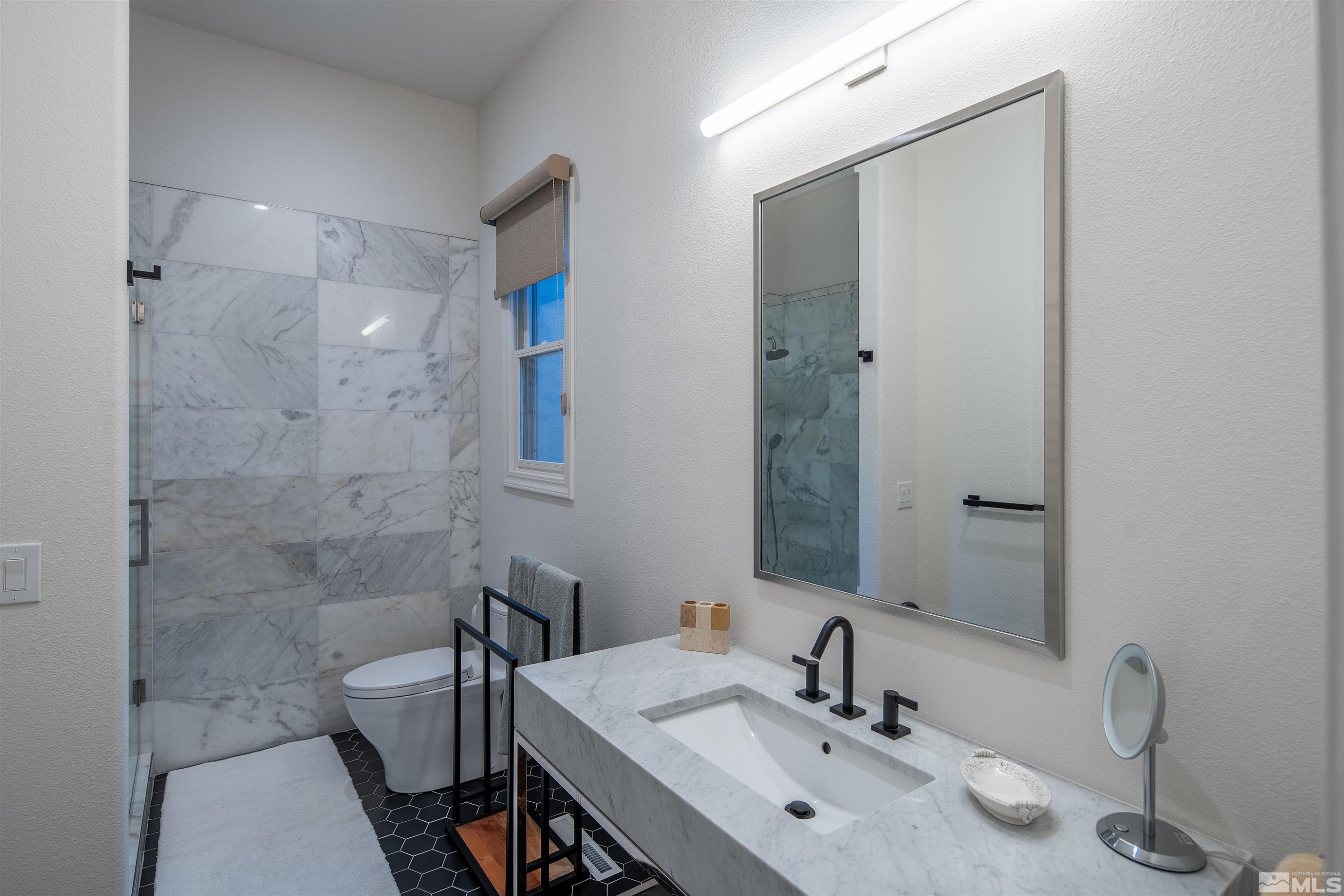 4305 Juniper Trail Reno, NV 89519 - Photo 26 of 30 a bathroom with a sink and a mirror