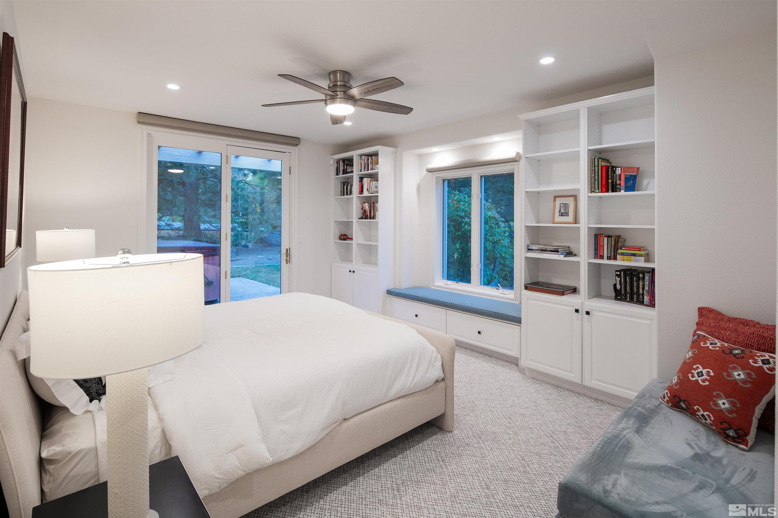 4305 Juniper Trail Reno, NV 89519 - Photo 27 of 30 a spacious bedroom with a bed and cabinets