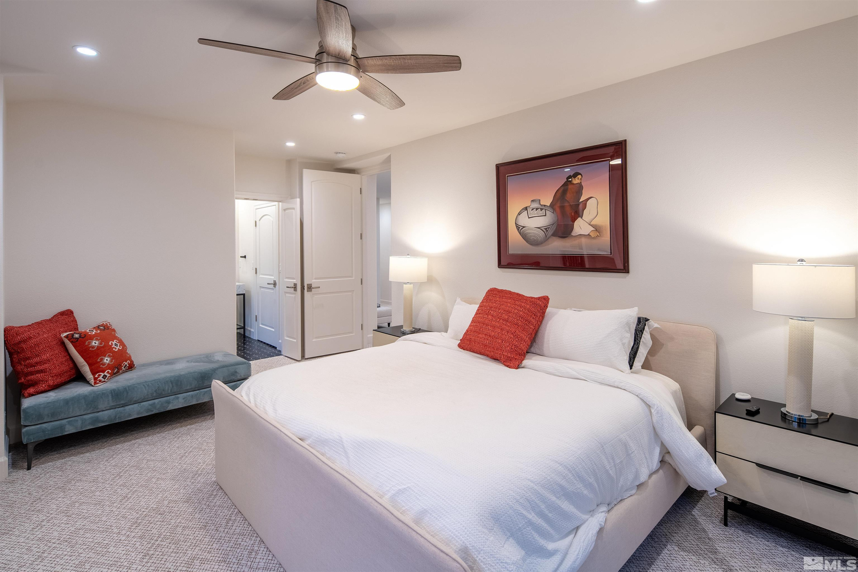 4305 Juniper Trail Reno, NV 89519 - Photo 28 of 30 a spacious bedroom with a bed and ceiling fan