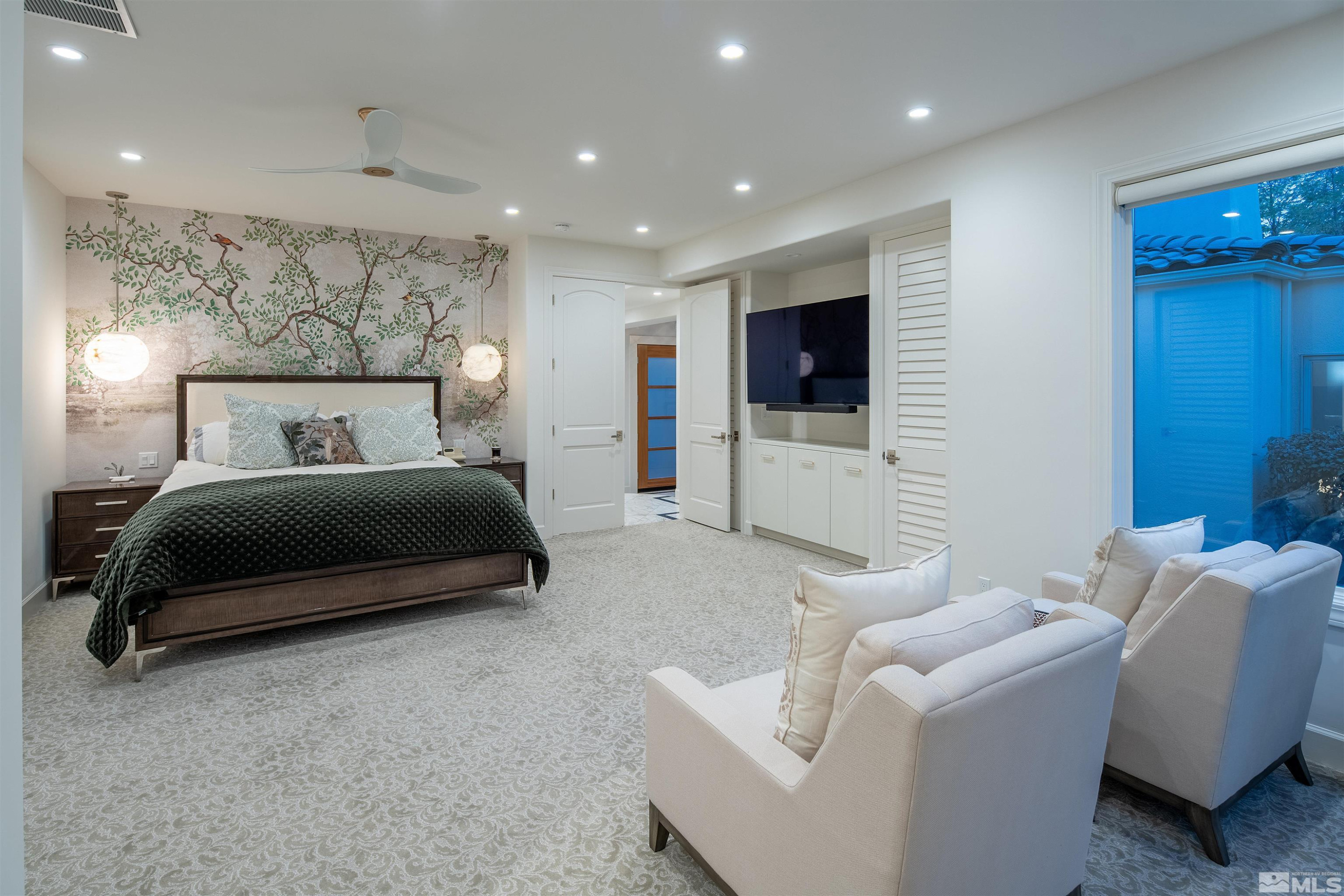 4305 Juniper Trail Reno, NV 89519 - Photo 9 of 30 a bedroom with a bed and a flat screen television