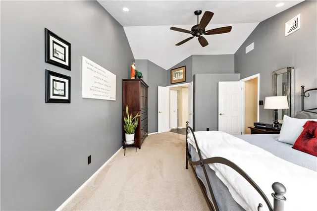 a bed room with a bed and a chandelier