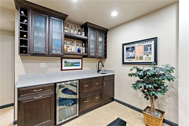 a hallway with a potted plant on the counter and a window