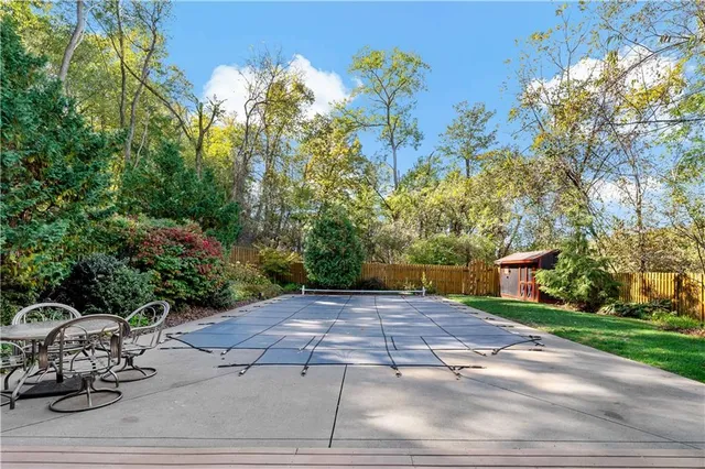 a view of a backyard with sitting area