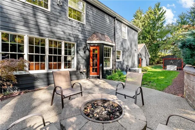 a view of a patio with table and chairs and potted plants