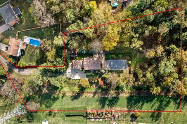 an aerial view of residential houses with outdoor space