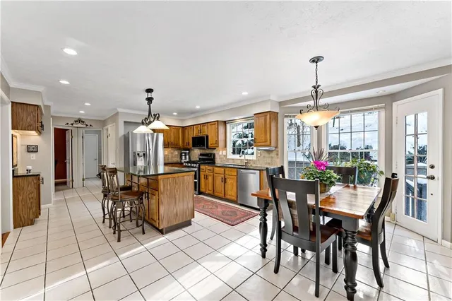 a dining room with furniture and window