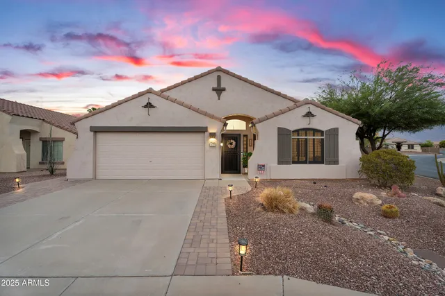 a view of a house with a yard and garage