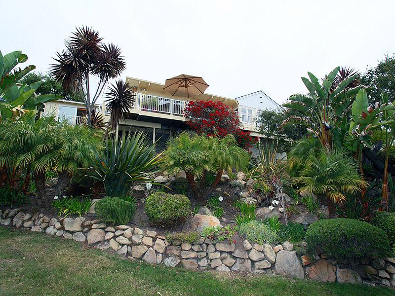 16 Rubio Road Santa Barbara, CA 93103 - Photo 15 of 23 a view of a house with a yard and potted plants