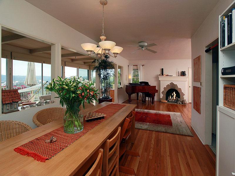 16 Rubio Road Santa Barbara, CA 93103 - Photo 7 of 23 a view of a dining room with furniture a chandelier and large windows