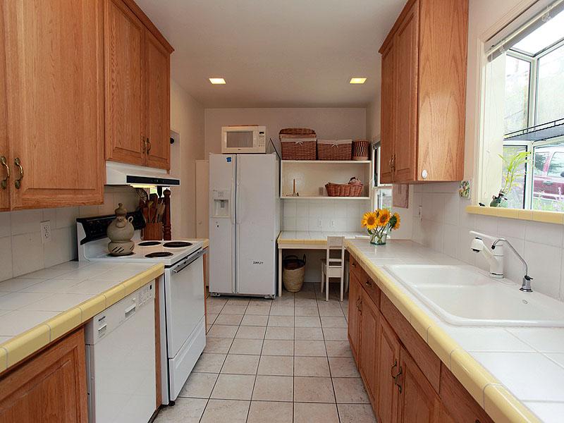 16 Rubio Road Santa Barbara, CA 93103 - Photo 8 of 23 a kitchen with a sink appliances and cabinets