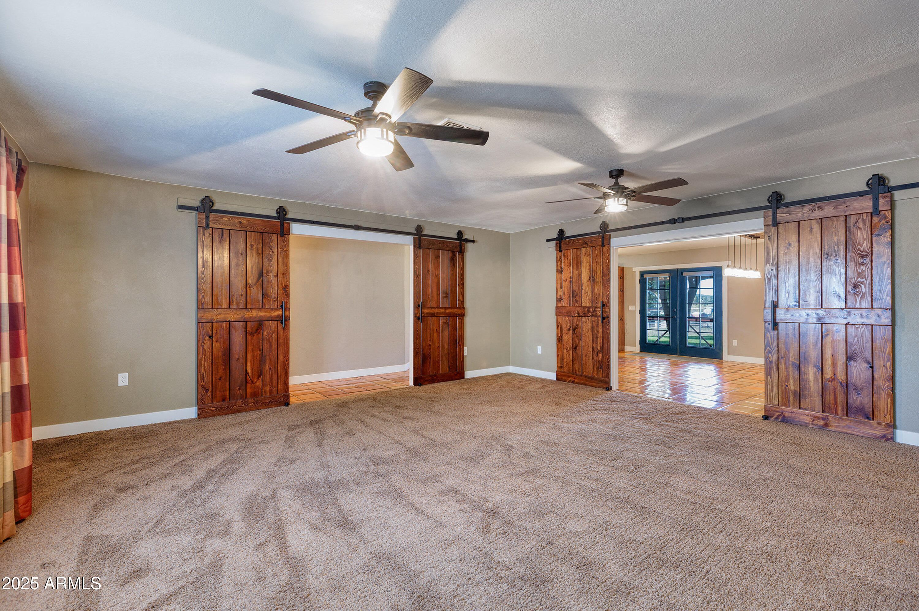 981 Oak Grove Road Show Low, AZ 85901 - Photo 14 of 61 a view of an empty room with closet and a window