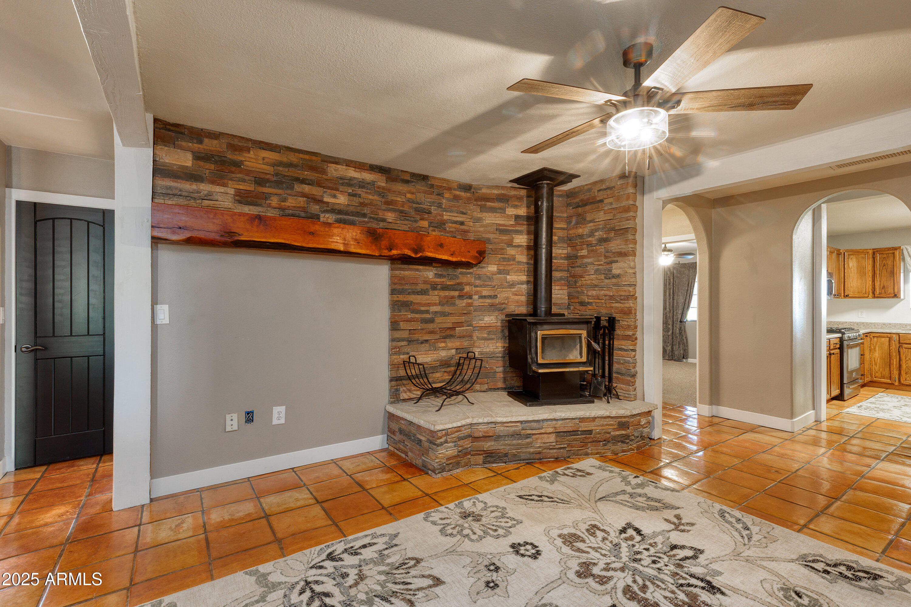 981 Oak Grove Road Show Low, AZ 85901 - Photo 15 of 61 a view of a livingroom with a fireplace