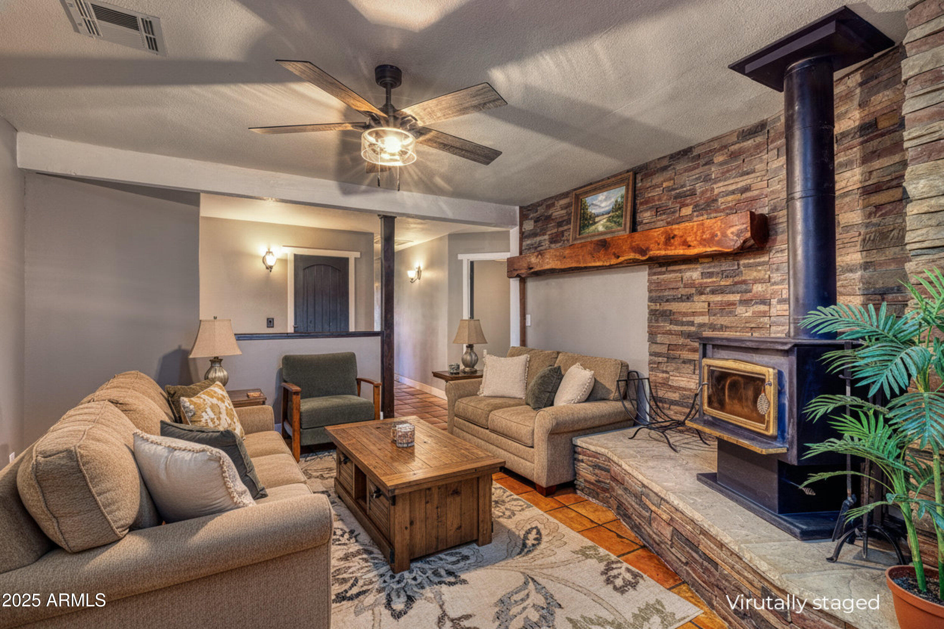 981 Oak Grove Road Show Low, AZ 85901 - Photo 16 of 61 a living room with furniture and a fireplace