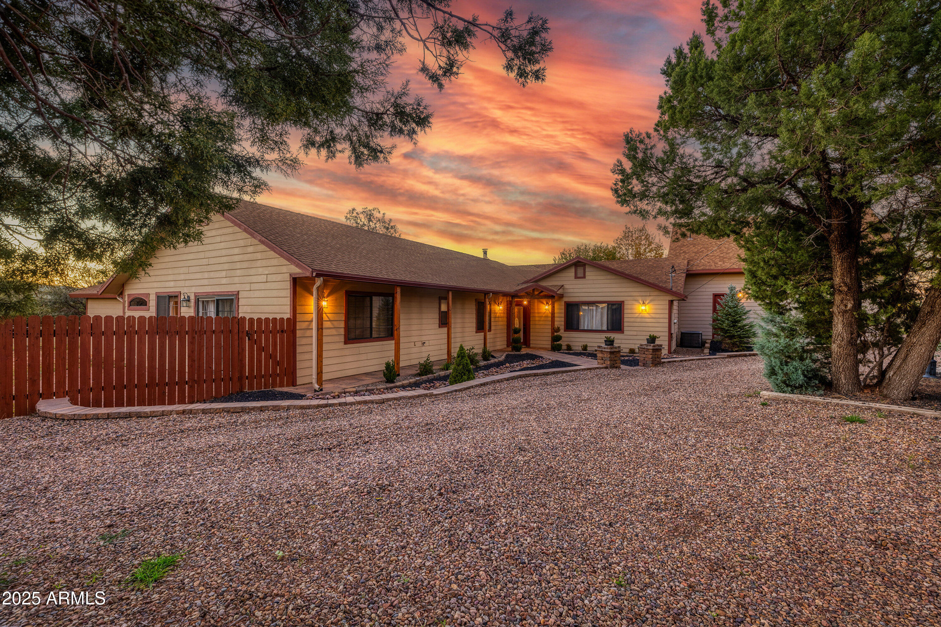 981 Oak Grove Road Show Low, AZ 85901 - Photo 2 of 61 a front view of a house with a garden