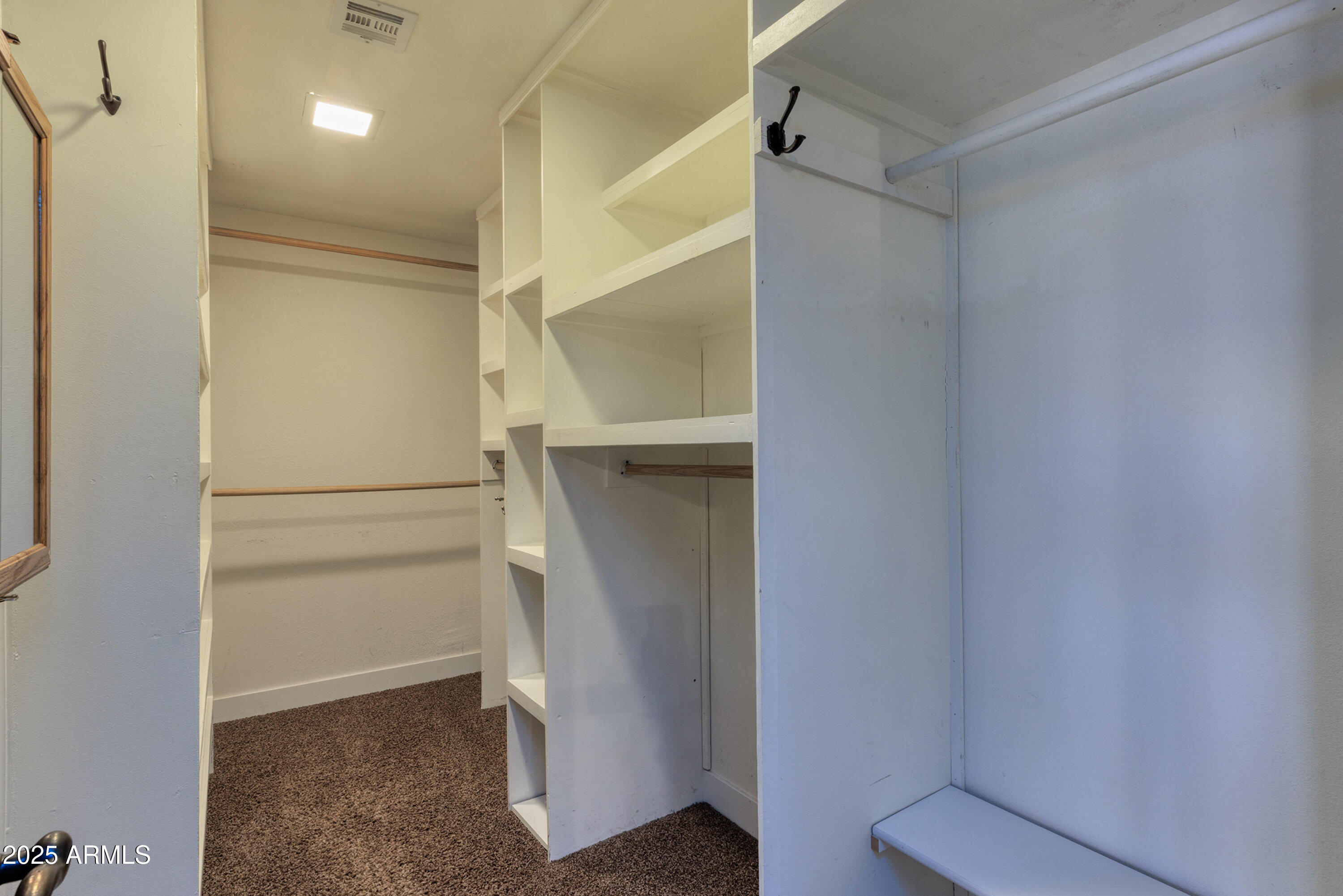 981 Oak Grove Road Show Low, AZ 85901 - Photo 31 of 61 a view of an empty walk in closet