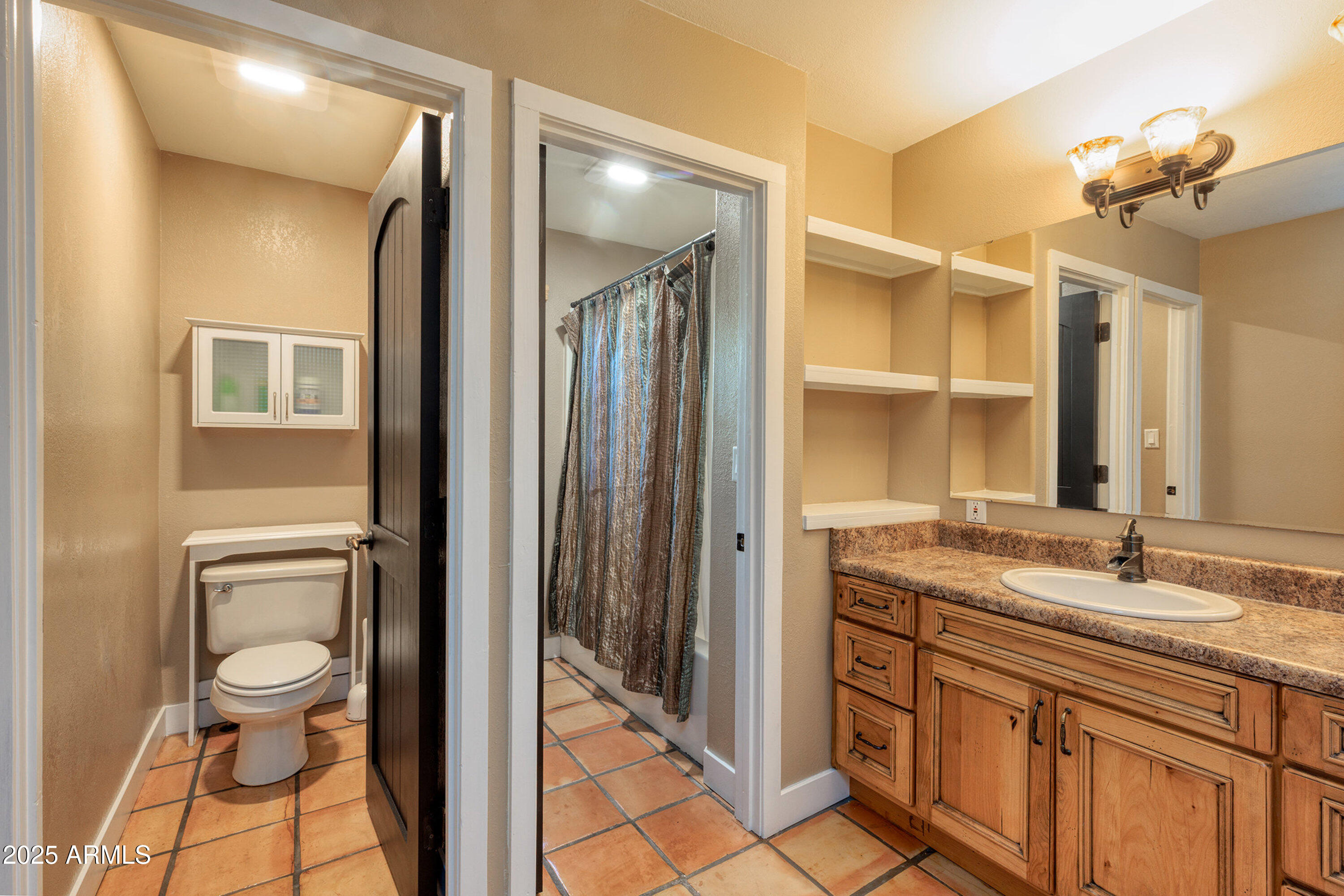 981 Oak Grove Road Show Low, AZ 85901 - Photo 36 of 61 a bathroom with a granite countertop sink toilet and shower