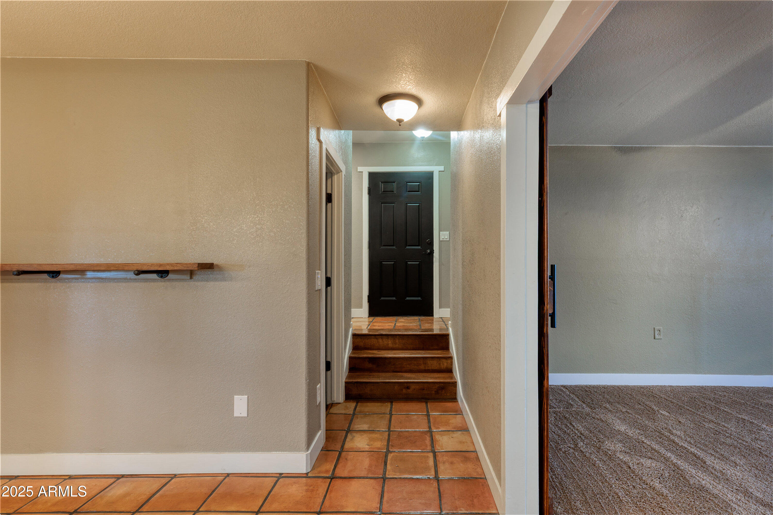 981 Oak Grove Road Show Low, AZ 85901 - Photo 39 of 61 a view of a hallway with wooden floor and staircase