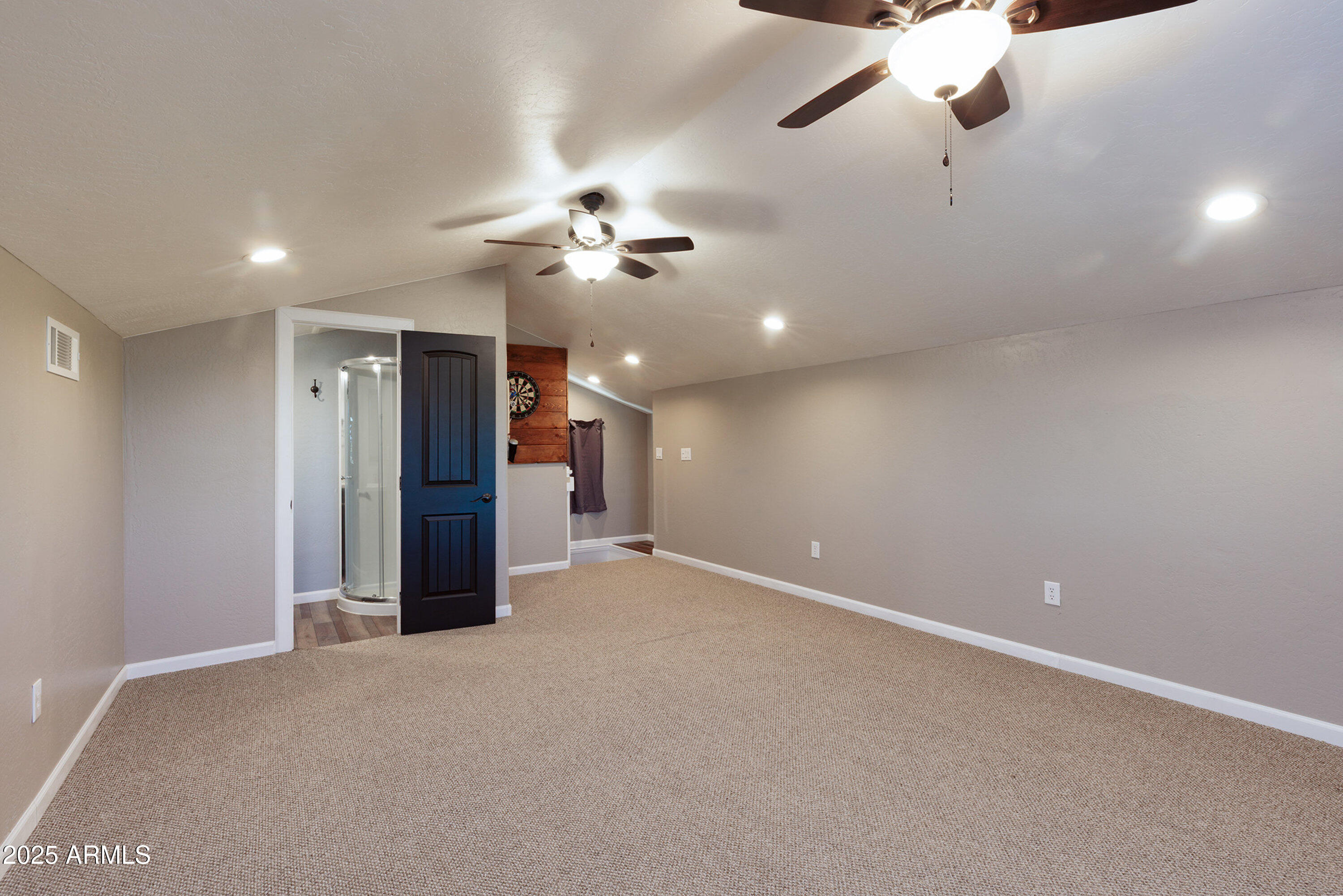 981 Oak Grove Road Show Low, AZ 85901 - Photo 42 of 61 a view of an empty room with a ceiling fan