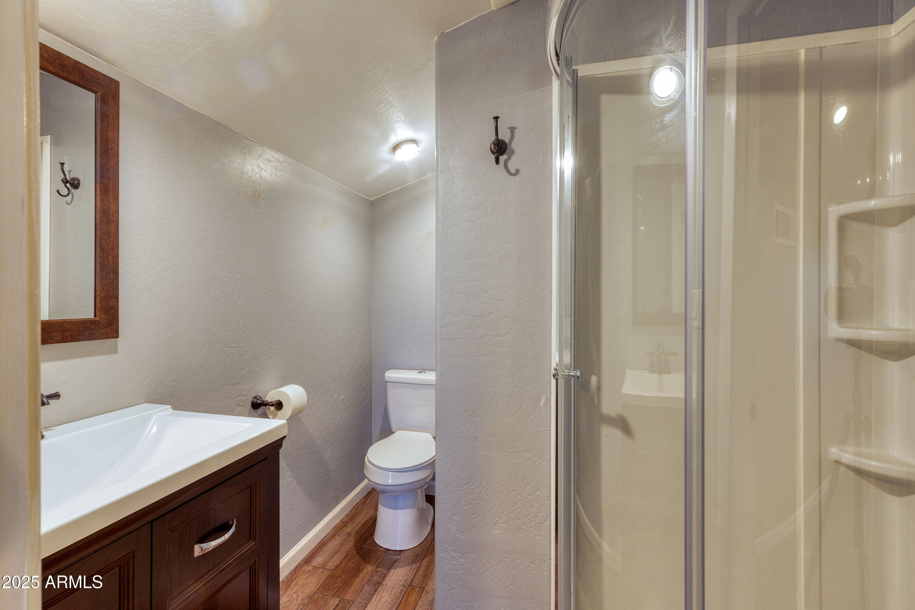 981 Oak Grove Road Show Low, AZ 85901 - Photo 43 of 61 a bathroom with a toilet sink and shower