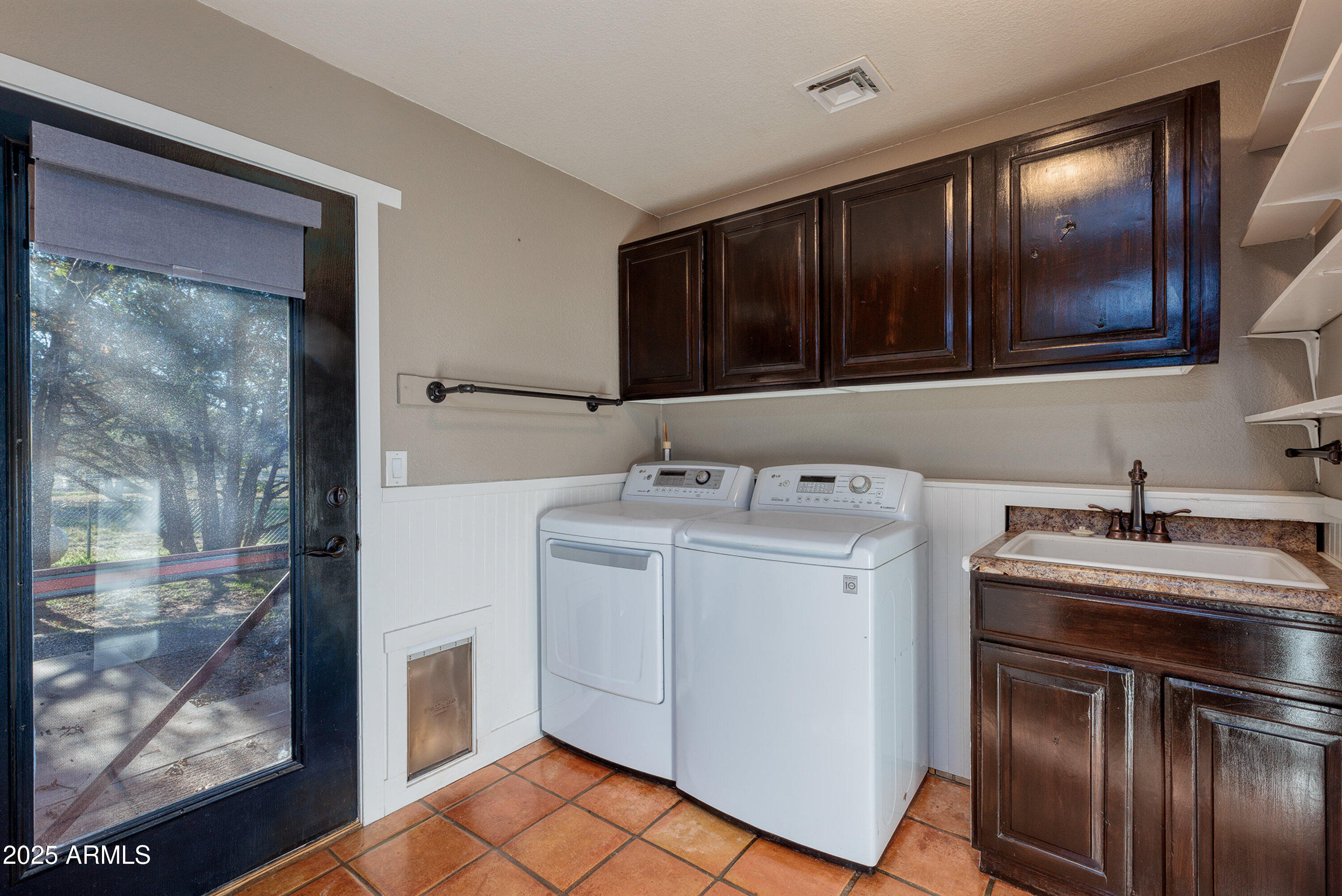 981 Oak Grove Road Show Low, AZ 85901 - Photo 44 of 61 a utility room with washer and dryer