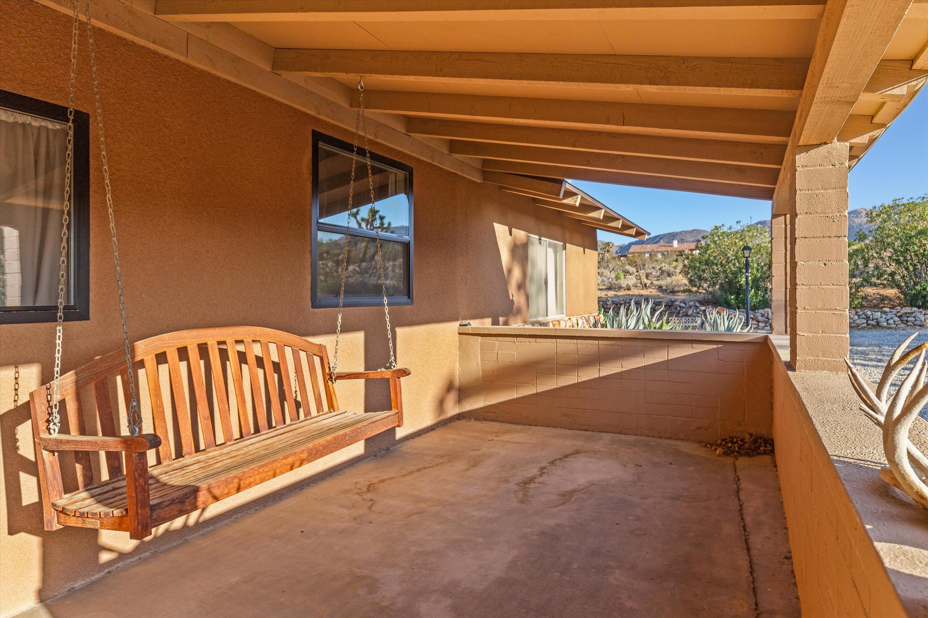 6785 Saddleback Road Joshua Tree, CA 92252 - Photo 14 of 50 a view of porch with a patio