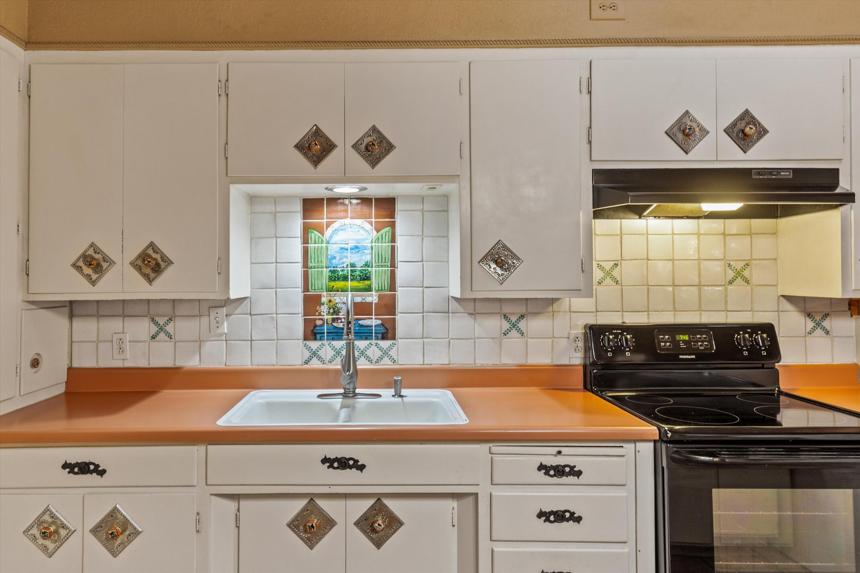 6785 Saddleback Road Joshua Tree, CA 92252 - Photo 21 of 50 a kitchen with a stove and a sink