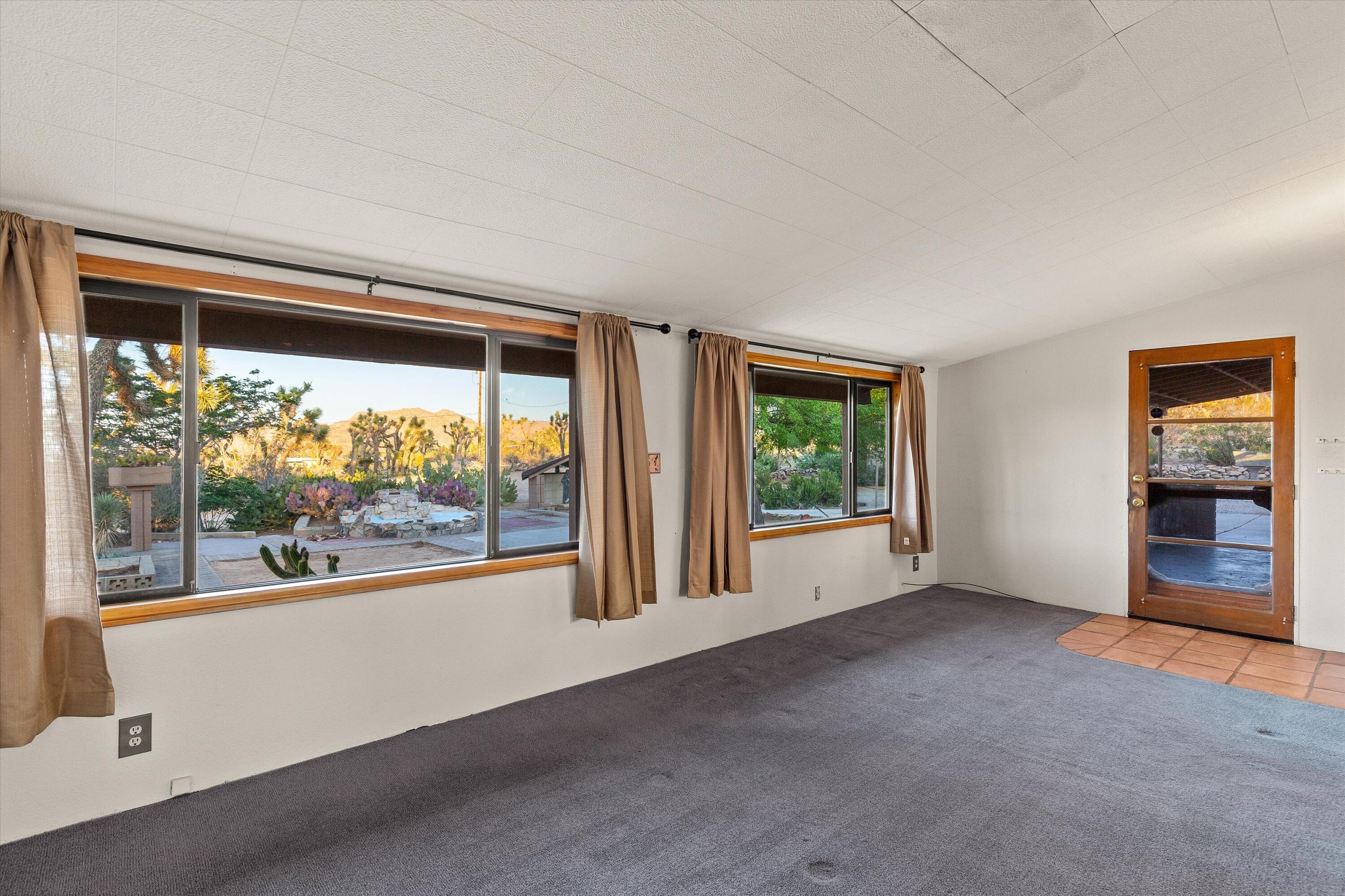 6785 Saddleback Road Joshua Tree, CA 92252 - Photo 24 of 50 a view of an empty room with a window