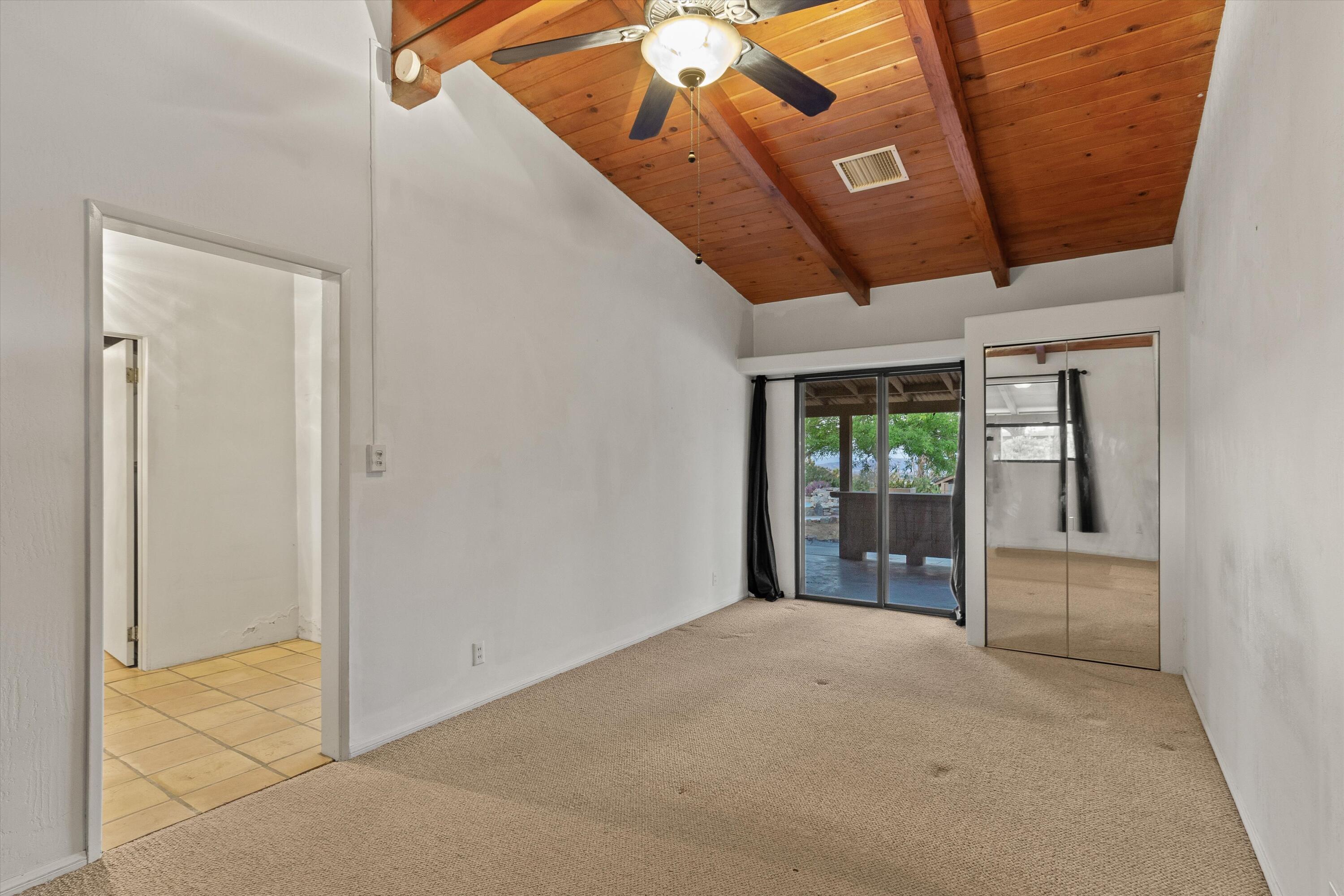 6785 Saddleback Road Joshua Tree, CA 92252 - Photo 25 of 50 a view of a hallway with a window